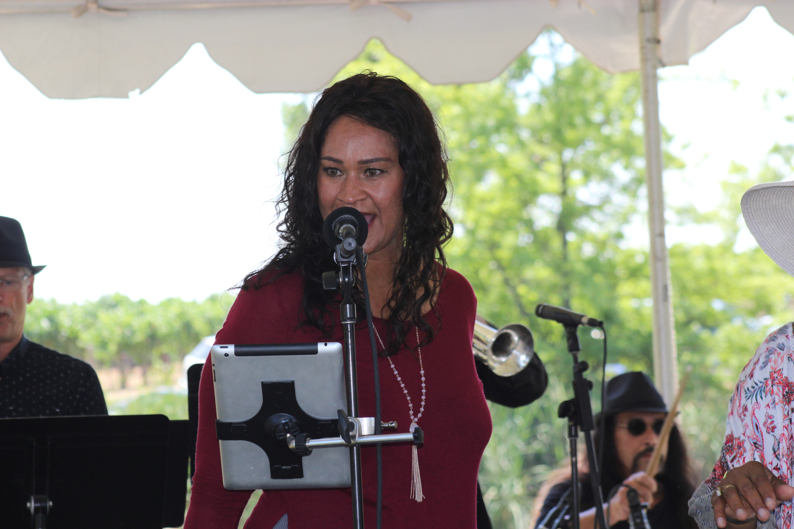 Trumpet player in tan jacket