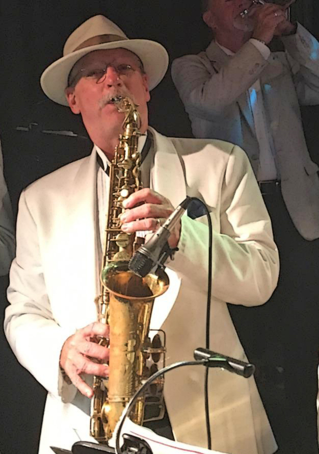 Saxophone player in cream jacket with fedora